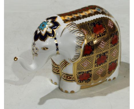 A Royal Crown Derby paperweight, Imari Elephant, raised trunk, gold stopper, 10.5cm high, printed mark, first quality 