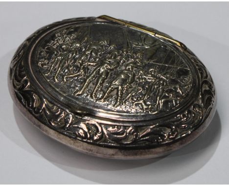 An unmarked white metal oval snuff box, embossed lid with cavaliers 