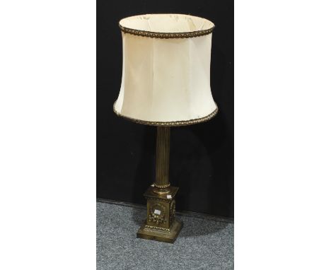 A composite cast Corinthian column lamp base, the capital cast with scrolls, fluted column, square base 