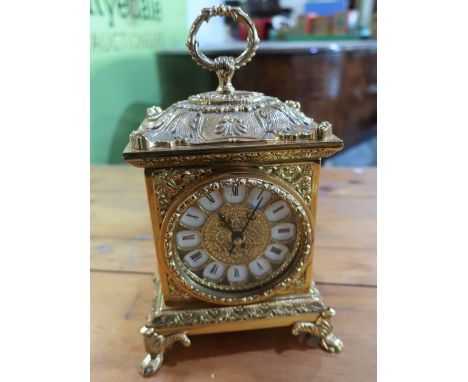 Cast gilt metal mantel clock, cartouche dial and carry loop on four paw feet H24cm 