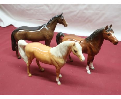 Two Beswick horses including: Palomino and another similar horse (3) 