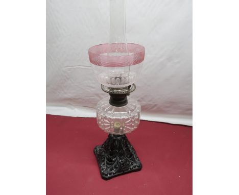 Late 19th C oil lamp with cranberry and cut glass shade clear reservoir on square pierce tapering foot H59cm 