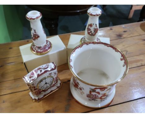 Pair of boxed red Mandalay Bruges candlesticks, similar jardinere H15cm and a quartz mantel clock H24cm (4) 