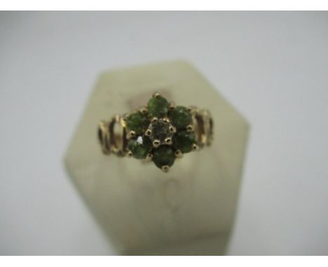 Hallmarked 9ct gold peridot and diamond cluster ring, London, 1975  Size O, gross 2.9g 