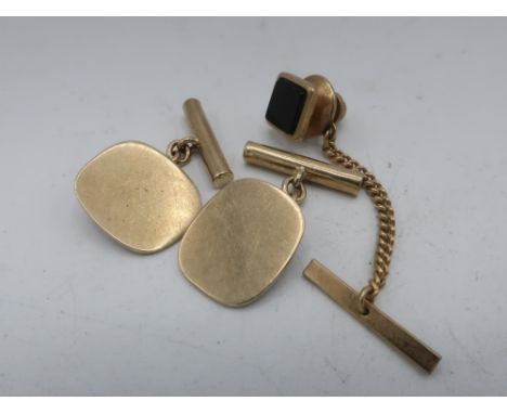 Pair of hallmarked 9ct gold oval cuff links, Birmingham 1978 6.9g, and a yellow metal tie pin (3) 