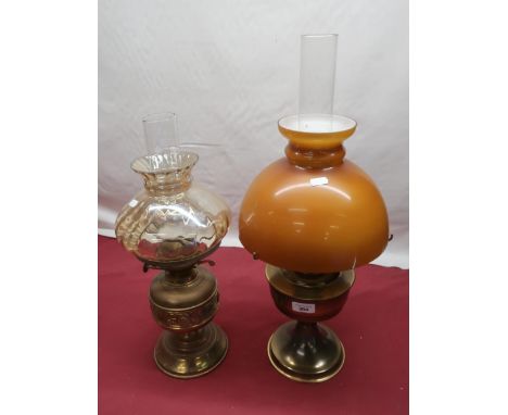20th C Aladdin paraffin lamp with opaque amber coloured shade, brass body on circular pedestal foot H60cm and another brass b