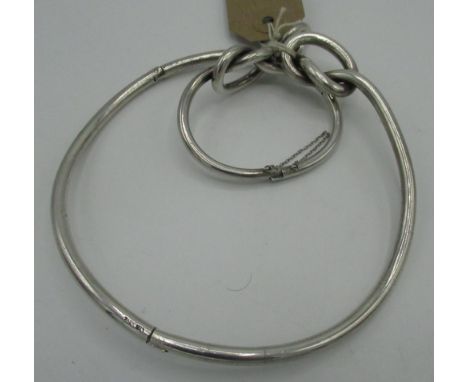 Suite of silver jewellery of knot form comprising, bangle, necklace and ring (size K), stamped (3) 5.7oz 