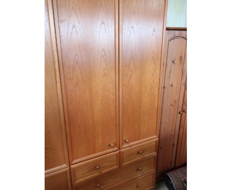 Teak four piece bedroom suite with: two wardrobes W90cm D60cm H210cm, tall chest of five drawers and a low chest of drawers (