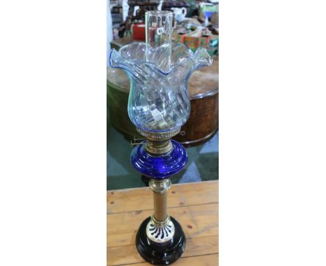 Early 20th C oil lamp, stepped circular base and fluted column with blue glass reservoir and blue tint shade, clear glass chi