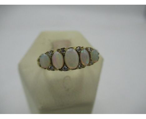 Hallmarked 9ct gold opal and eight stone diamond ring Size O, 4.1g 