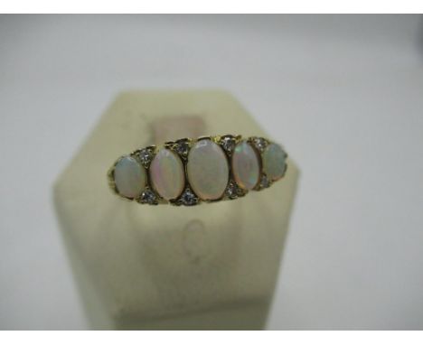 Hallmarked 9ct gold opal and eight stone diamond ring Size O, 4.1g 