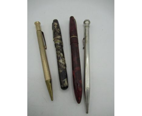 Waterman's marble effect fountain pen, another fountain pen, a silver-plated Wahl Eversharp propelling pencil and a rolled go