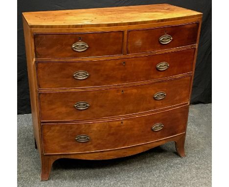 A Victorian mahogany bow front chest of drawers, caddy top, two short cockbeaded drawers over three graduated long, splayed b