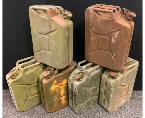 A vintage metal jerry can;  others, four stamped with broad arrow, one with ?Combatgas F-46? badge. (6) 