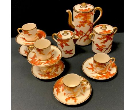 A Japanese Satsuma six-setting coffee set, painted with leafy trees in autumnal tones, gilt and black diaper bands, comprisin