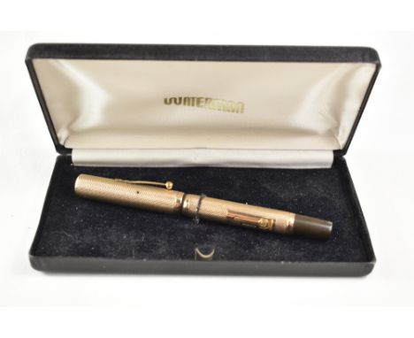 A boxed Waterman Ideal lever fill fountain pen with a 9ct engine turned gold cap and barrel cover having Waterman Ideal nib. 