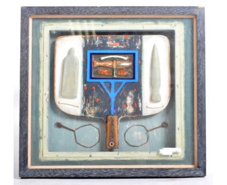 A framed and glazed 3D abstract wooden panel artwork sculpture having applied decoration with a central fish with with bones 