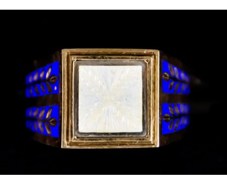 A 9ct Gold Gentleman's Enamel Ring, embellished to the shoulders with blue enamel work depicting leaves, size R+, gross weigh