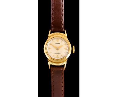 A Lady's Manual Wind Wristwatch, by Rolex, Model Presion, 18ct gold case, 17mm diameter, champagne dial with gold baton numer