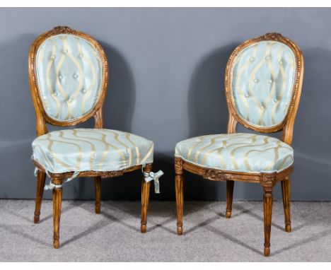 A Pair of 19th Century French Beech Wood Framed Chairs, the moulded frames carved with reeded and ribbon ornament, the back a