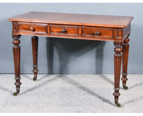 An Early Victorian Mahogany Side Table, with moulded edge to top, fitted two real and one dummy drawer to frieze, on heavily 