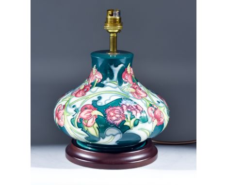 A Moorcroft Pottery Table Lamp,&nbsp;tube-lined and decorated with a flower design, and shade for same,&nbsp;19ins high overa