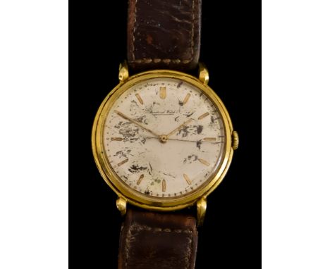 A Gentleman's Manual Wind Wristwatch, by I W C, 18ct gold case, 37mm diameter, silvered dial with gold baton numerals, on non