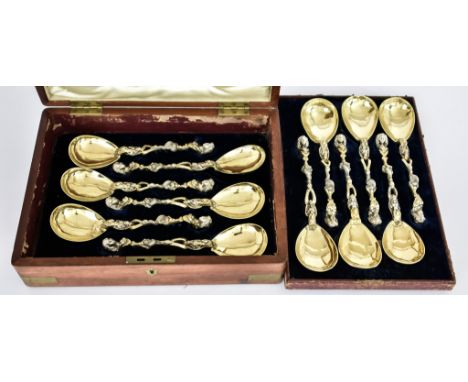 A Set of Twelve Mid-19th Century Continental Cast Parcel Gilt Silver Serving Spoons, stamped with one hand in an oval and 13 