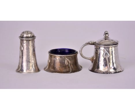 A George V Silver Arts and Crafts Three-Piece Condiment Set, by A.E. Jones, Birmingham 1912, of circular planished and tapere