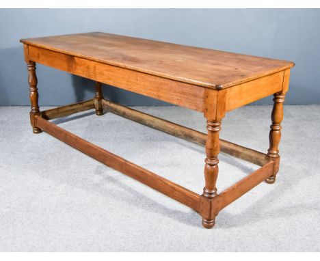 A Late 18th/Early 19th Century Pitch Pine Refectory Kitchen Table, with six plank cleated top, and on baluster turned support