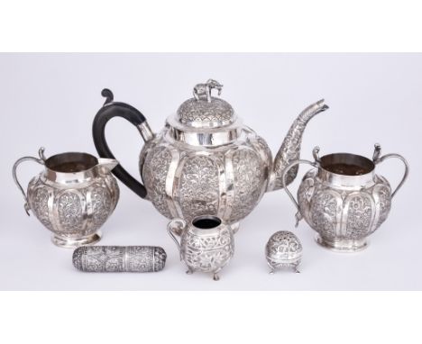 A Near Eastern White Metal Three-Piece Tea Service and Mixed White Metalware, the tea service of bulbous lobed form with pane
