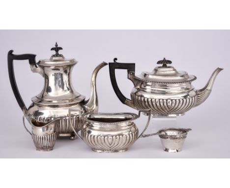 A Victorian/ Edward VII Harlequin Silver Tea and Coffee Set and a Tea Strainer, the set by various makers, Sheffield 1898, Lo