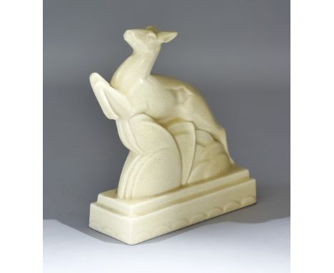 A Carter, Stabler and Adams Poole Pottery Model of a Leaping Deer, with cream glaze, impressed mark, 8insThere is some spray 