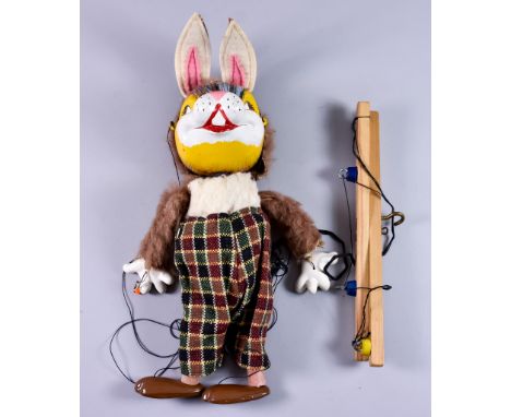 A Rabbit Pelham Puppet, Circa 1960, with felt ears and checked trousers,&nbsp;puppet 12ins overall, in original box, together