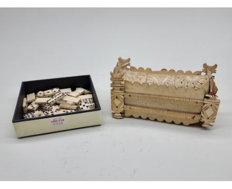 A Napoleonic prisoner-of-war carved bone sarcophagus form domino box,&nbsp;the inner cover of pierced cribbage form, with an 