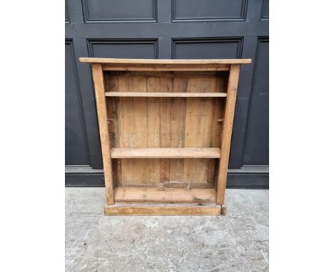 An antique pine open bookcase,&nbsp;92cm wide; together with a mahogany filing shelf, 40 x 51cm. (2) 