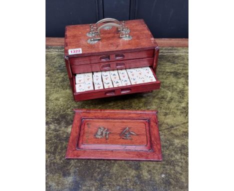 A Chinese hardwood cased bone and bamboo mahjong set.&nbsp; 