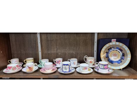 Twelve Royal Worcester cups and saucers; together with a similar Millennium plate, each boxed. (13) 