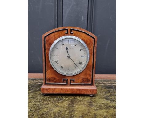 A small 1930s figured walnut mantel clock, the silvered dial inscribed 'Mappin &amp; Webb Ltd', 17cm high.&nbsp; 