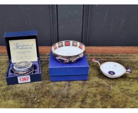 A Crummles limited edition 'Dawn of the Millenium' enamel box, 6cm diameter; together with two Royal Crown Derby Imari items.