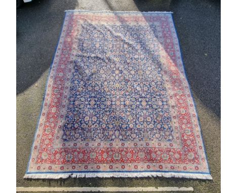 A large Persian carpet, having allover floral decoration, 415 x 303cm. 