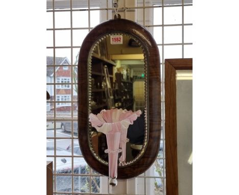 A coloured glass mounted mirror back wall epergne, with walnut frame,&nbsp;43cm high. 