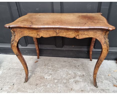 A good late 19th century, Louis XV style, burr walnut and crossbanded serpentine card table, with gilt brass mounts and fold-