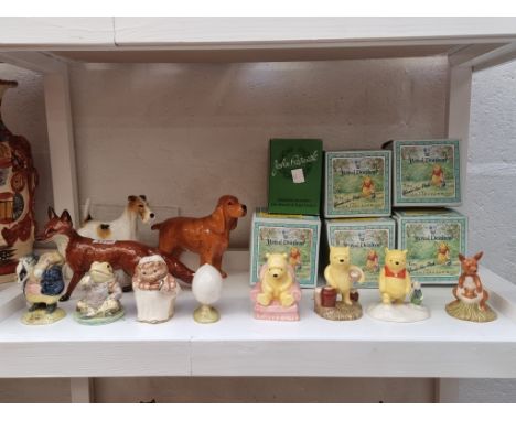 Three Beswick animals,&nbsp;largest 25cm long; together with five Royal Doulton 'Winnie-the-Pooh' collection figures, each bo