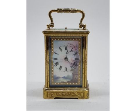 A good late 19th century French brass and porcelain mounted carriage clock, striking on a gong and with push button repeat, h