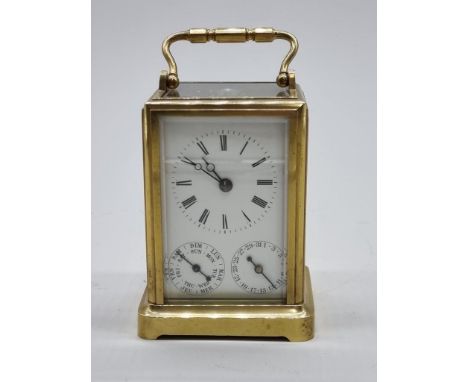A good 19th century French brass calendar carriage clock,&nbsp;with subsidiary dials for date and day of the week, height inc