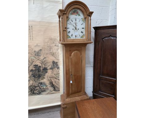 A 19th century pine 8 day longcase clock with arched top and turned pillars to the hood, arched full length door, arched pain