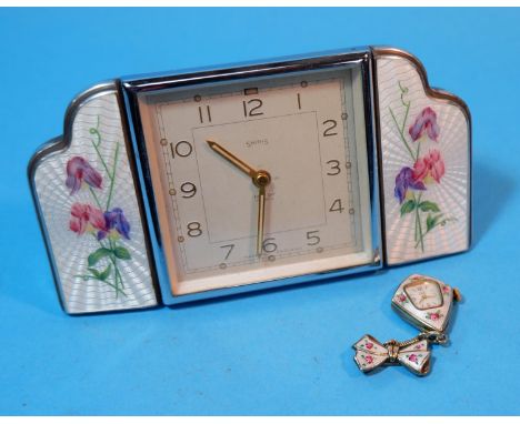 A 1930's Smiths dressing table clock with square chrome framed central clock flanked on either side with by engine turned whi