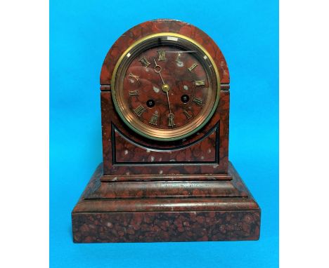 A 19th century mantel clock in red veined marble arch top case, with gilt numerals and French drum movement striking on bell,