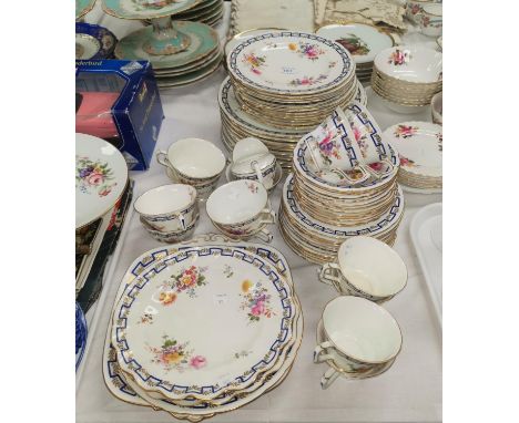A Royal Crown Derby dinner and tea service with polychrome bouquets of flowers and intertwined blue and gilt border, 62 piece
